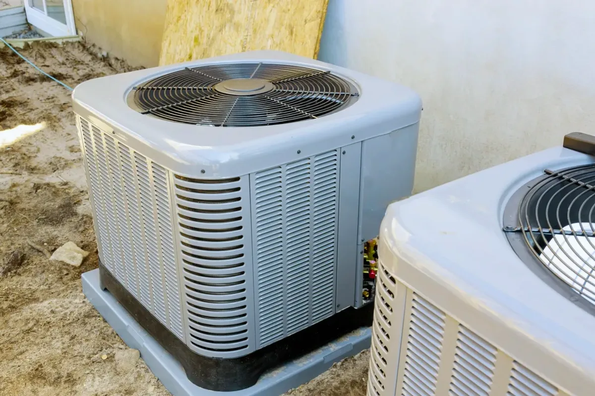 Two outdoor air conditioner condensers