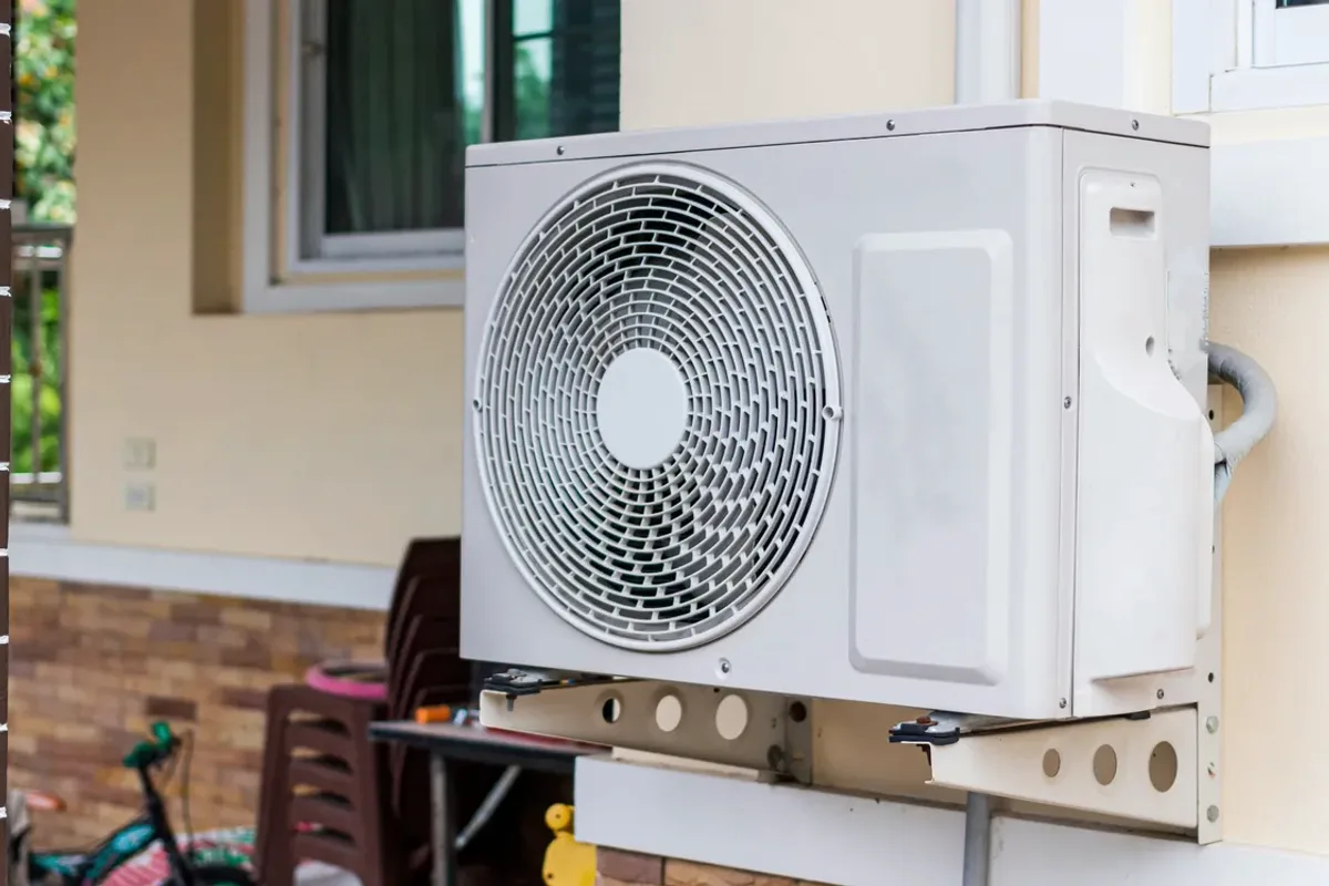 Outdoor heat pump unit on a wall bracket